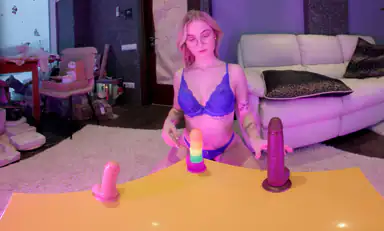 Cherry Blossom Tellblonde Luanas Toy Challenge Three Dildos on the Table